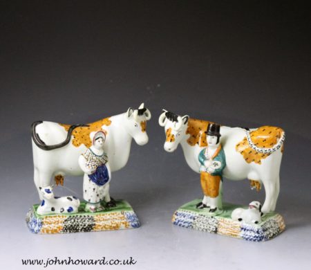 Pair of antique Yorkshire pottery prattware cows with attendants, Mexborough Pottery.