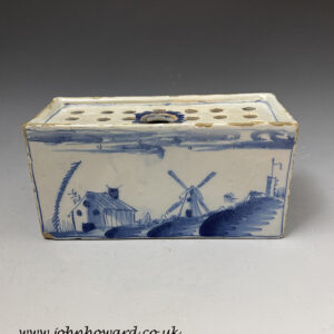 English Liverpool delftware earthenware flower brick with a blue decorated rural  windmill scene mid 18th century