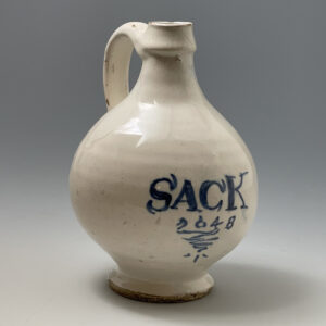 A London Delfware Wine bottle inscribed in blue SACK 1648 .