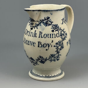 Early Swansea  Cambrian Pottery painted blue pitcher with  America related verse “Drink Round Brave Boys”.  circa 1790