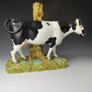Large scale Staffordshire pearlware figure of a cow with spill circa 1820
