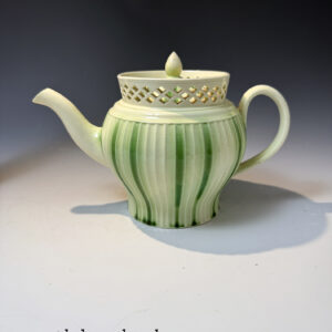 Creamware pottery teapot with underglaze green stripes late 18th century Yorkshire.