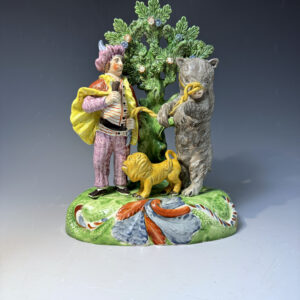 Staffordshire pottery pearlware bocage figure group of a Savoyard with a bear and lion.