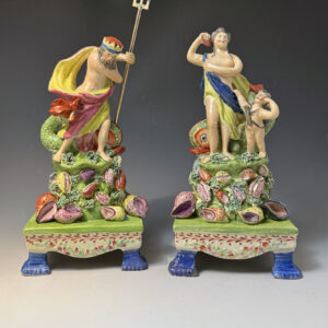Pair of pearlware table base figures of Venus and Neptune Staffordshire c1820