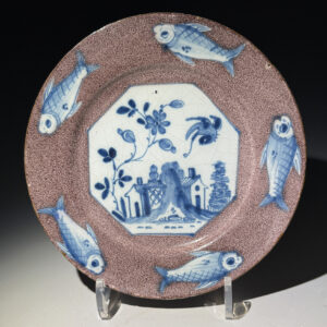 English delftware pottery plate  with a manganese border with five blue fish circa 1750